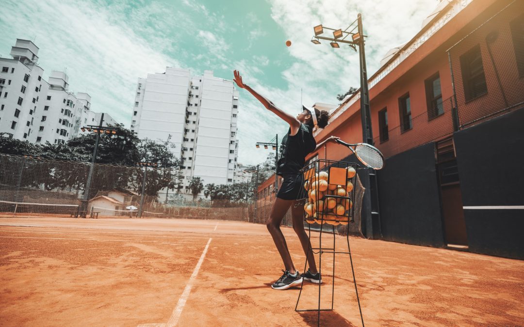 black-girl-playing-tennis-on-court.jpg